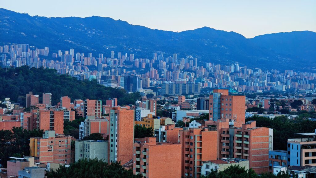 Cost of living in Colombia 2026, Medellín skyline with mountains, for Americans