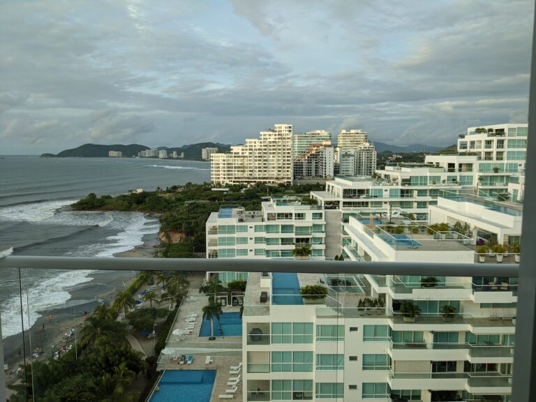Santa Marta rooftop view looking across resorts toward the Caribbean beach