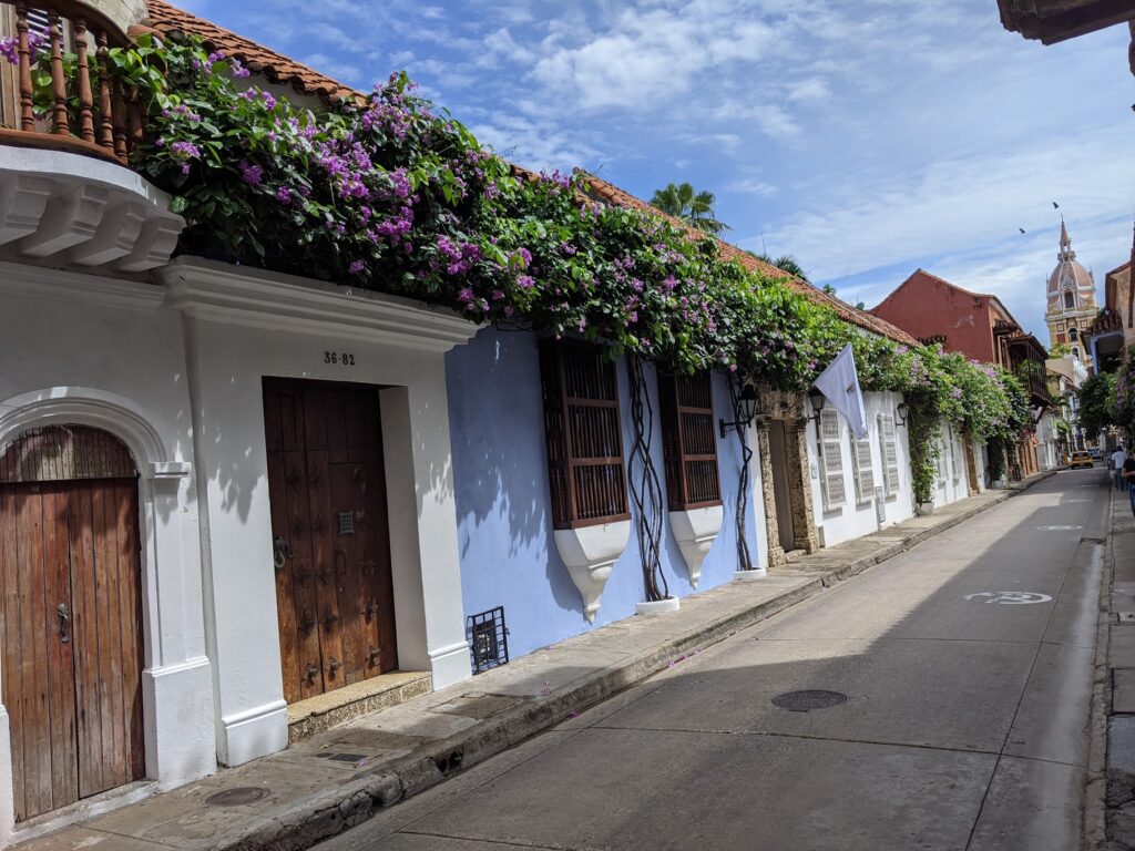 A street in the walled city of Cartagena, Colombia, with the old town and clock tower