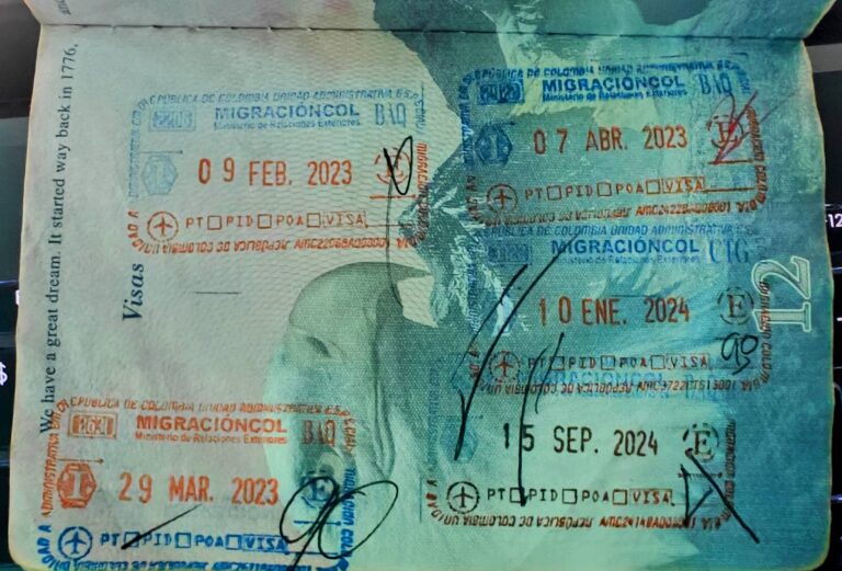 U.S passport page with entry and exit stamps from Migración Colombia.