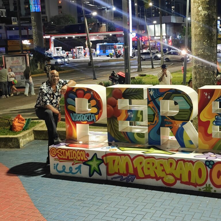 Shep at the Pereira landmark sign outside Victoria Mall — living in Colombia, coffee region