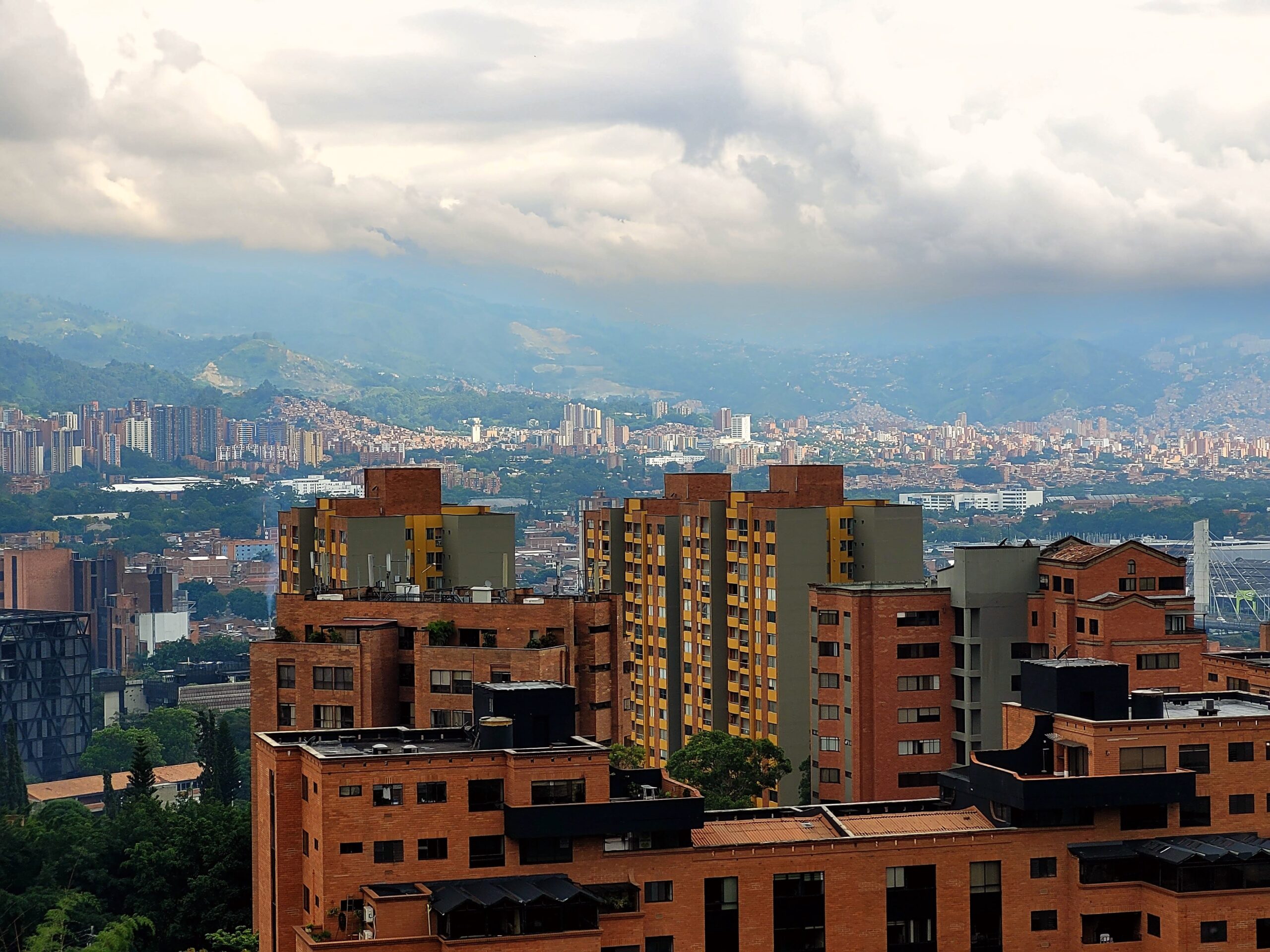 Panorama of Medellín, Colombia, the City of Eternal Spring, red-brick apartment buildings across the valley